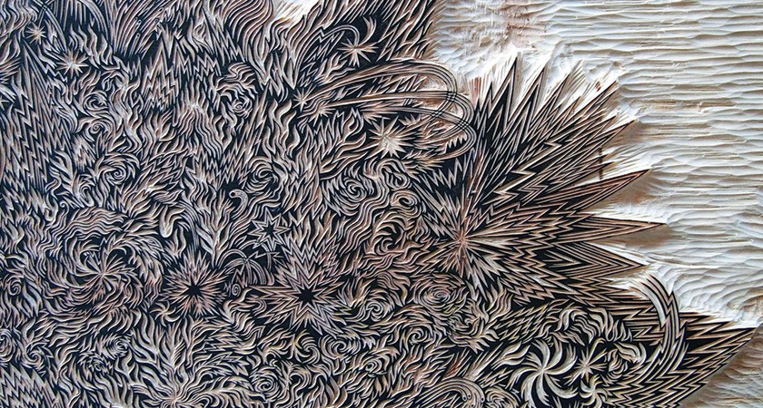 Close-up detail of an intricately carved wood block