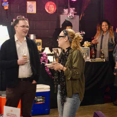 People socializing inside an arts space