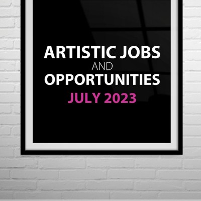 The words "Artistic jobs and opportunities July 2023" is written on top of a black frame hanging on a white brick gallery wall