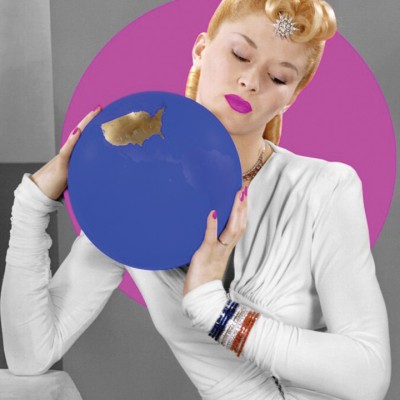 Woman with a retro blonde hairstyle, pink lips, and a white outfit holds a blue circular item 