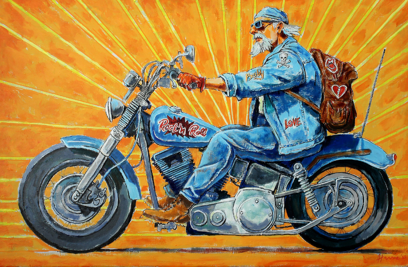 A bearded man in denim rides a blue motorcycle against a bright orange, sunburst background. He wears a bandana, sunglasses, gloves, and a backpack with heart patches. His jacket says RocknRoll and Love.