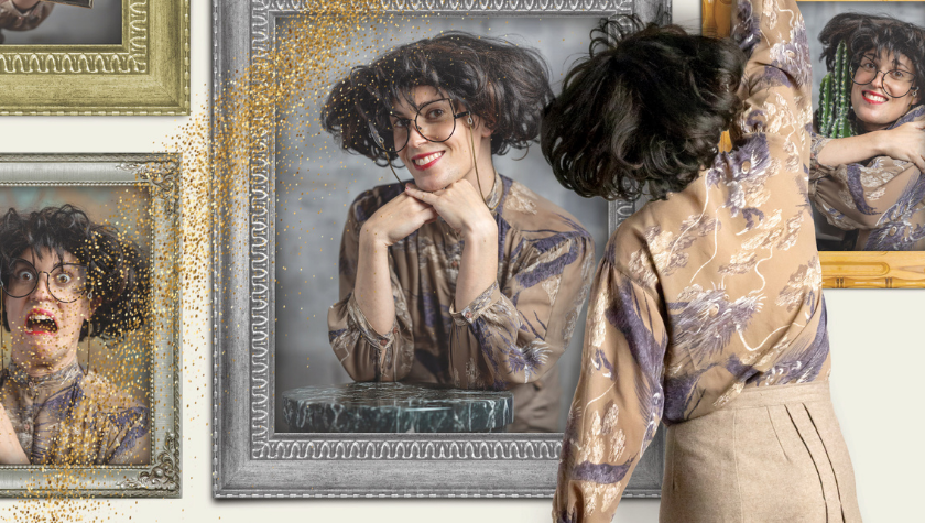 Person hangs a framed portrait of herself among other eccentric self-portraits.