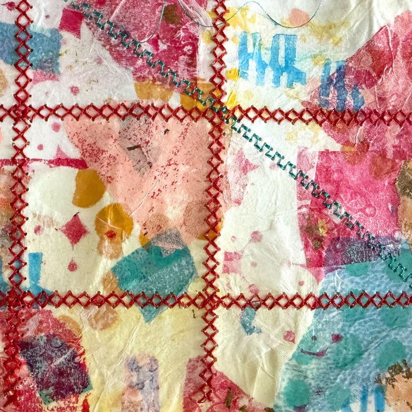Colorful abstract art with red stitched grid lines and splashes of paint on a textured surface.