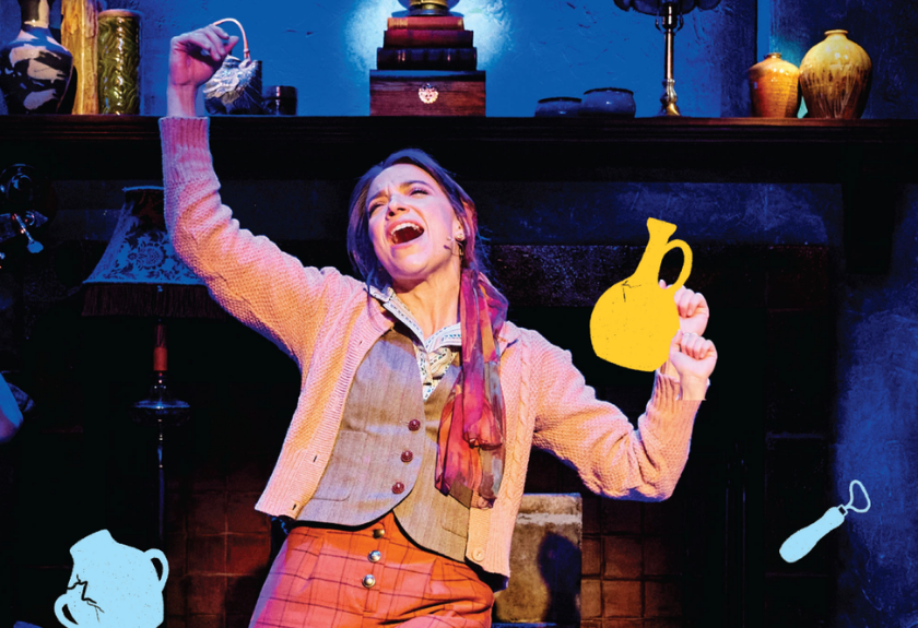 Woman singing on stage, holding illustrated pitchers, with a cozy set and warm blue lighting.