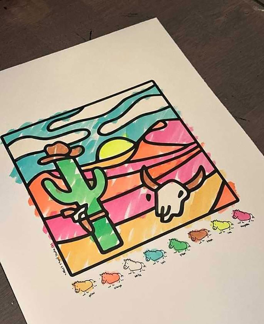 Colorful cartoonish artwork of a desert scene including a green cactus wearing a cowboy hat and a gun holster, a horned skull, and layers of pink-and-orange sand