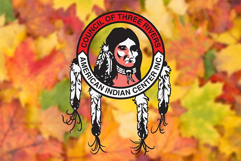 The logo for the Council of Three Rivers American Indian Center featuring an illustration of a Native American, placed on top of an image of fall leaves
