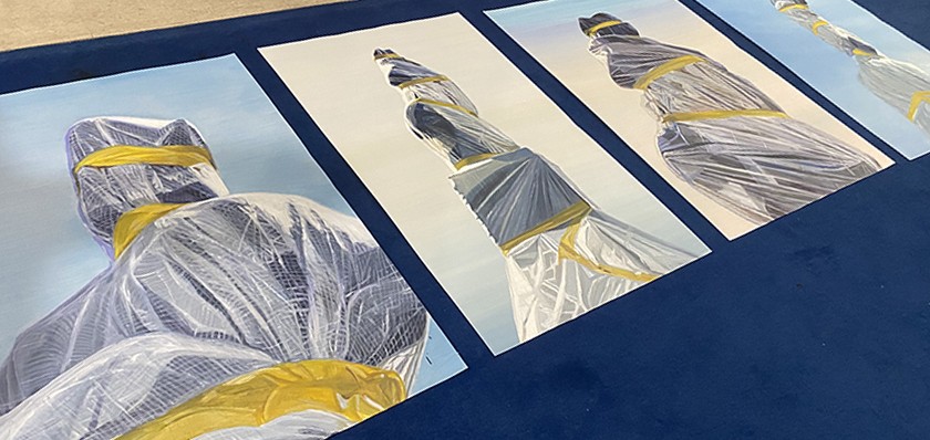 A series of four paintings showing Pittsburgh's Christopher Columbus statue wrapped in plastic and yellow tape