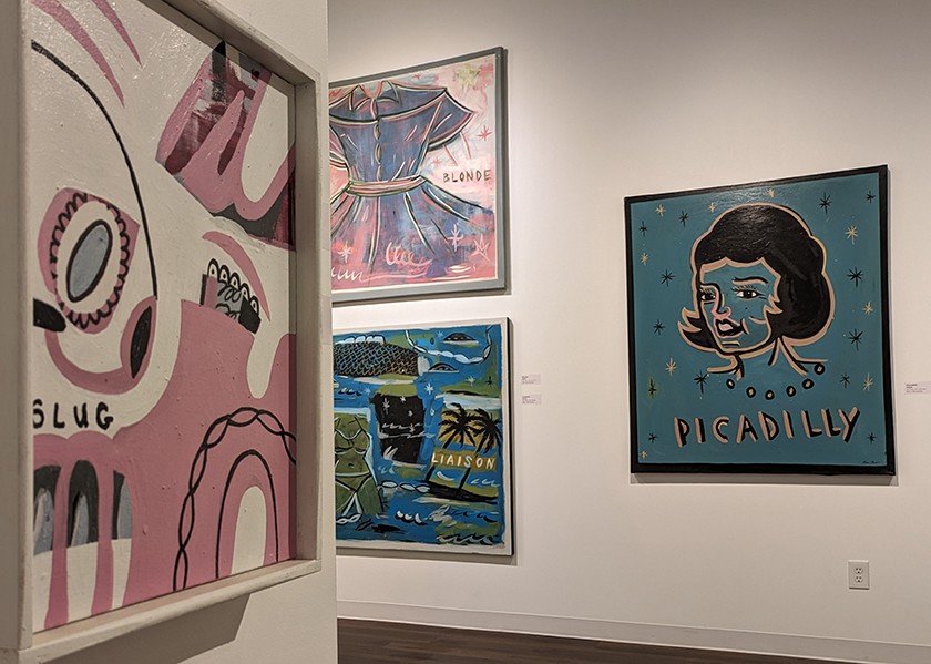 Four contemporary paintings hanging on a gallery wall. Paintings show a mix of abstract images with bright colors. Items identifiable in the paintings include a woman's dress, palm trees, and a woman's face