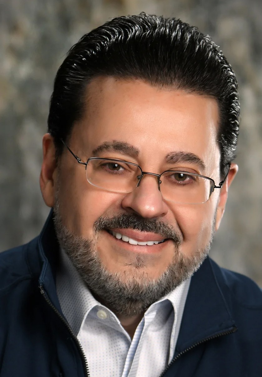 A headshot of John Weinstein
