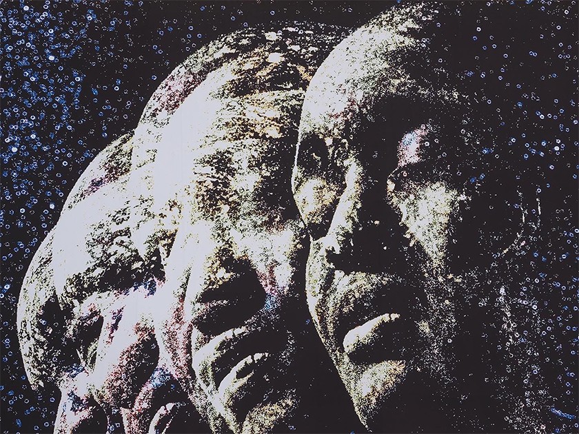 A close-up of a public art installation, featuring a celestial stop-motion-style photograph of a person's face