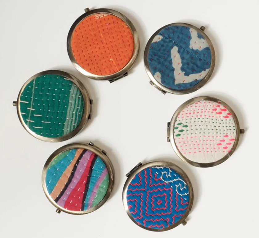 Assortment of colorful fabric-colored pocket mirrors