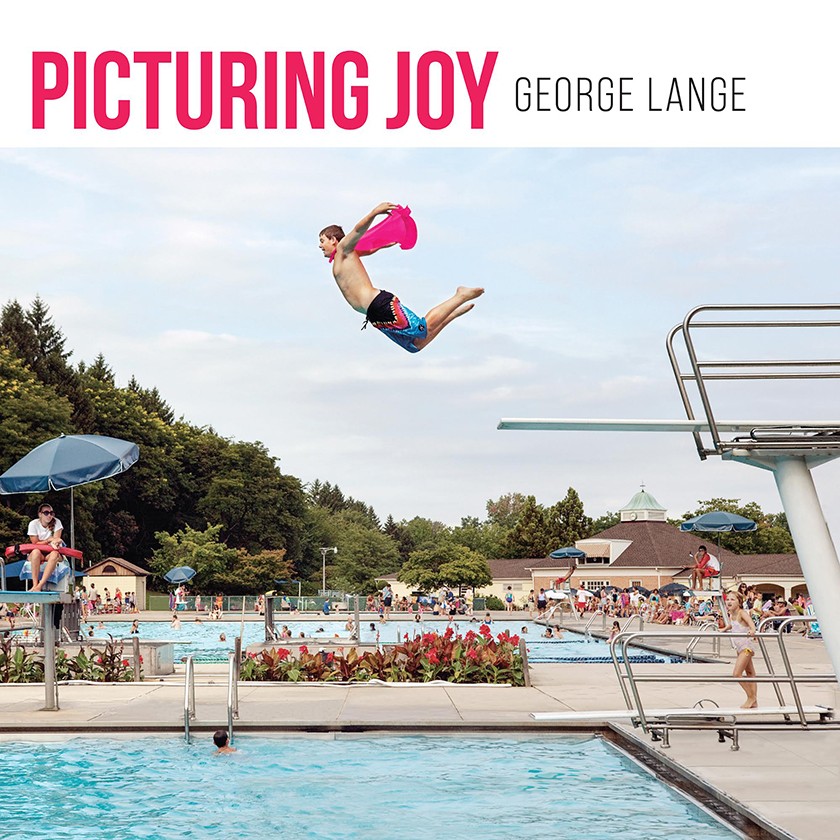 Book cover for Picturing Joy by George Lange. Photo of a boy wearing a cape and jumping off a high diving board into a swimming pool