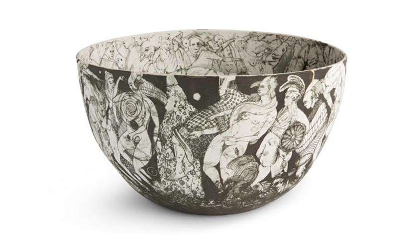 A ceramic black-and-white bowl illustrated with people