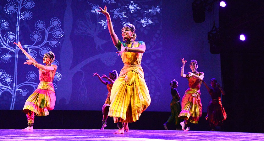 A group of Indian dancers perform on stage