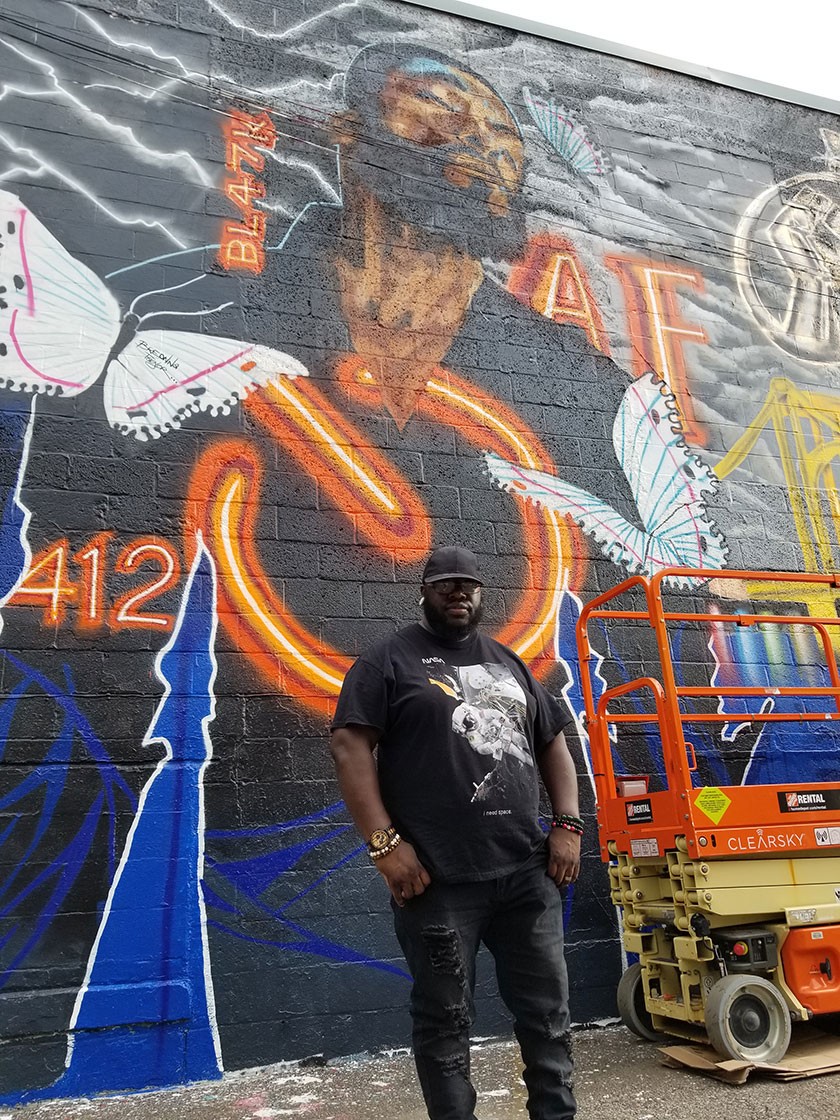 Natiq at Spirit Wall in Lawrenceville collaborative mural with Black Monarch. Photo by Natiq.