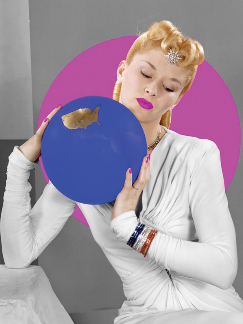 Woman with a retro blonde hairstyle, pink lips, and a white outfit holds a blue circular item 